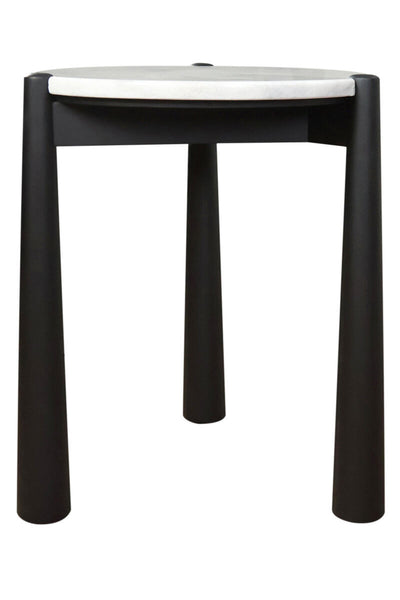 Round side table featuring a sleek white marble top and a sturdy black mango wood base. The table stands on four cylindrical legs, providing a modern aesthetic.