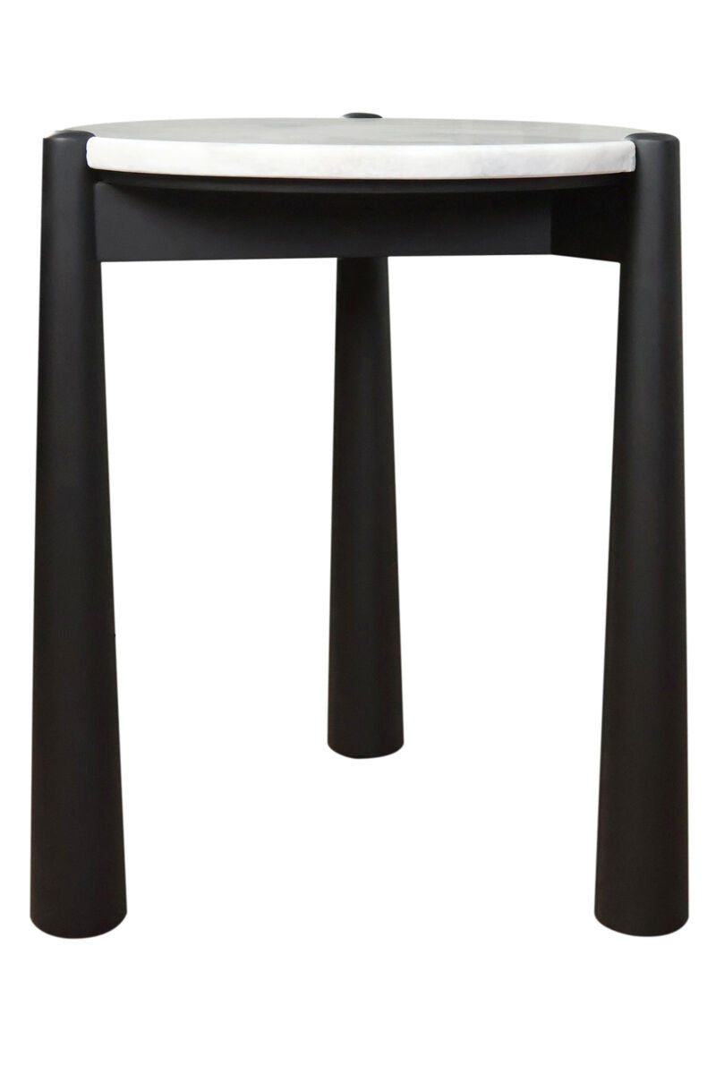 Round side table featuring a sleek white marble top and a sturdy black mango wood base. The table stands on four cylindrical legs, providing a modern aesthetic.