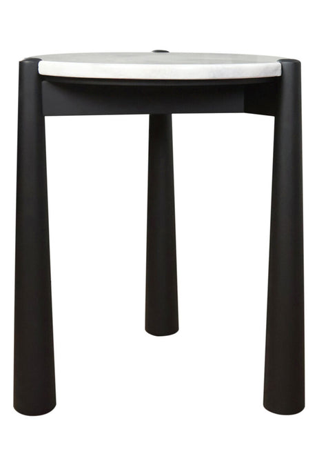 Round side table featuring a sleek white marble top and a sturdy black mango wood base. The table stands on four cylindrical legs, providing a modern aesthetic.