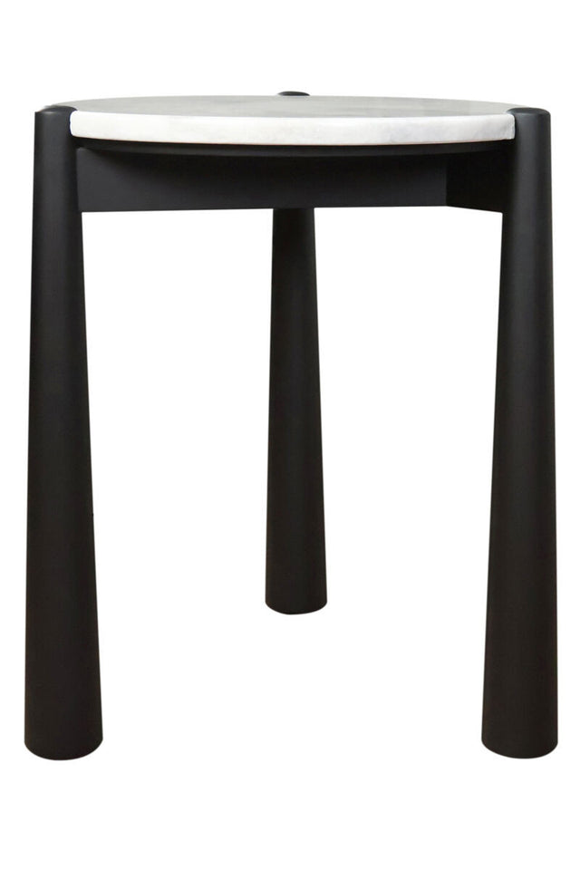 Round side table featuring a sleek white marble top and a sturdy black mango wood base. The table stands on four cylindrical legs, providing a modern aesthetic.