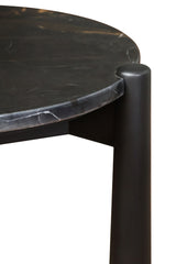 Round side table featuring a sleek black and white marble top with subtle veining, complemented by sturdy mango wood legs.