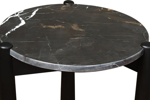 Round black marble top side table featuring striking white veining, supported by sleek black mango wood legs.