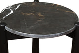 Round black marble top side table featuring striking white veining, supported by sleek black mango wood legs.