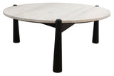 Round coffee table featuring a smooth travertine top with subtle texture and natural tones, supported by four sleek black mango wood legs.