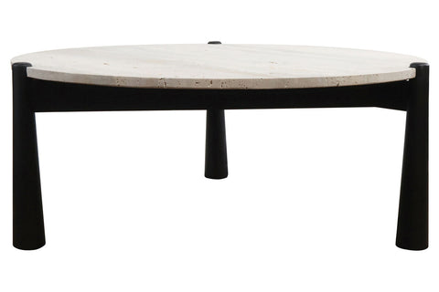 Round coffee table featuring a natural travertine top with subtle texture and a sleek black finish on the mango wood legs.
