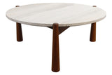Round coffee table featuring a smooth travertine top with subtle variations in color and texture, supported by four sturdy brown mango wood legs.