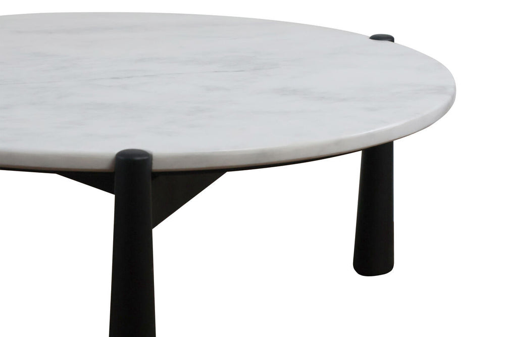 Round coffee table featuring a smooth white marble top with subtle gray veining, supported by sleek black mango wood legs.