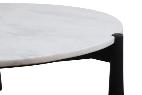 Round coffee table featuring a smooth white marble top with subtle veining, supported by sleek black mango wood legs.
