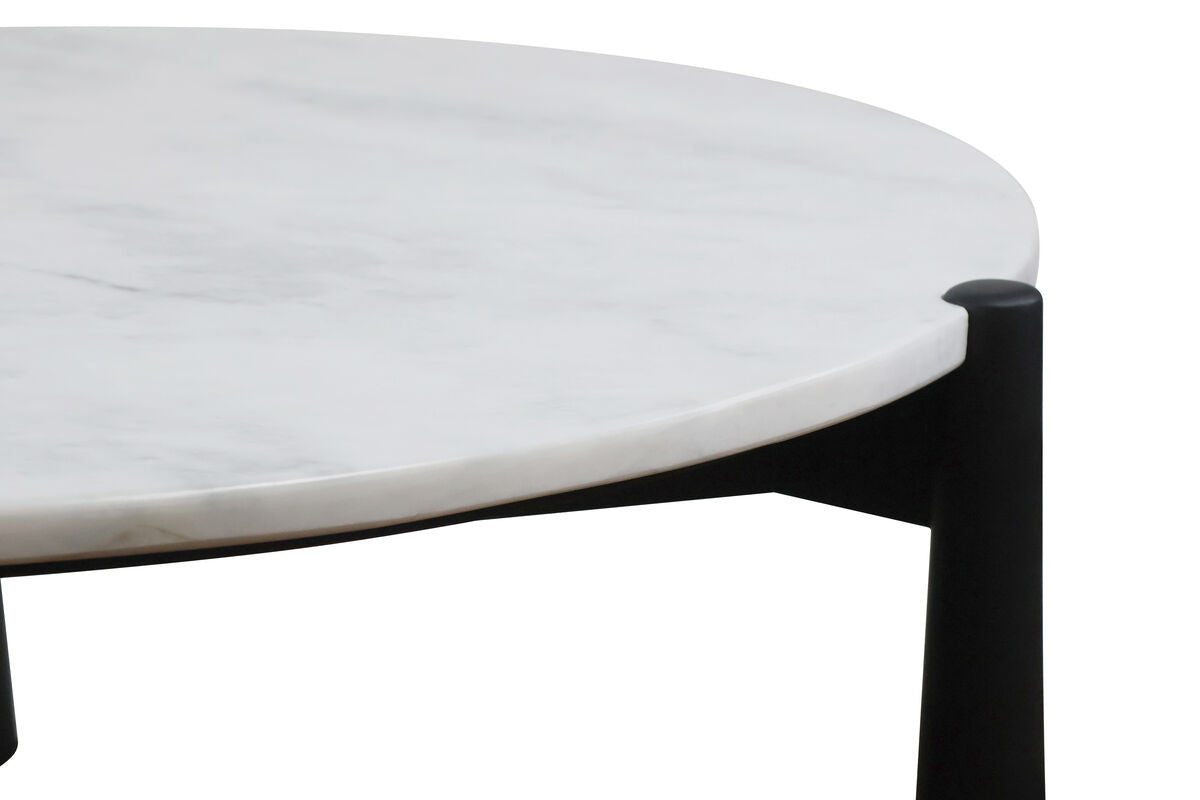 Round coffee table featuring a smooth white marble top with subtle veining, supported by sleek black mango wood legs.