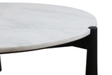 Round coffee table featuring a smooth white marble top with subtle veining, supported by sleek black mango wood legs.