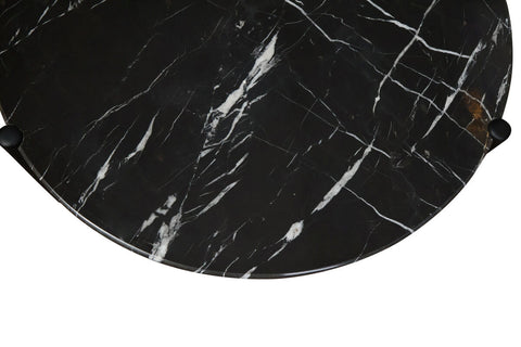 Black marble coffee table top featuring striking white veining, complemented by sleek black rounded legs.