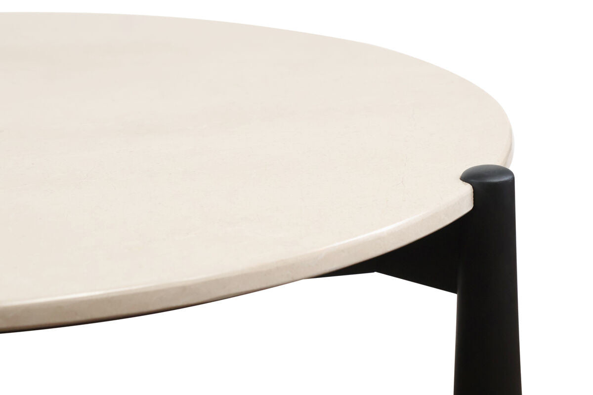 Cream marble top coffee table featuring a smooth, rounded surface with subtle veining, supported by sleek black mango wood legs.
