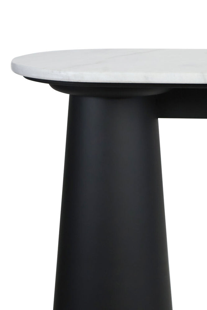 White marble top console table featuring a sleek black mango wood base. The rounded edges of the marble surface contrast with the bold, cylindrical shape of the legs.