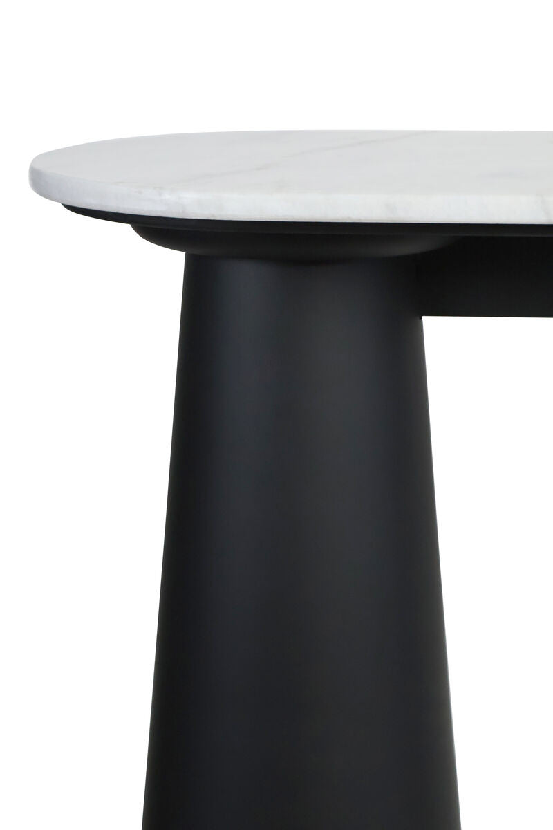 White marble top console table featuring a sleek black mango wood base. The rounded edges of the marble surface contrast with the bold, cylindrical shape of the legs.