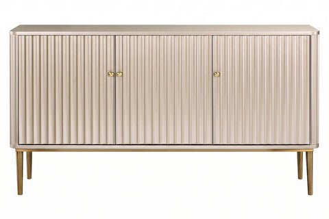 Three-door sideboard featuring a sleek design with vertical flute detailing, finished in a soft gold hue.