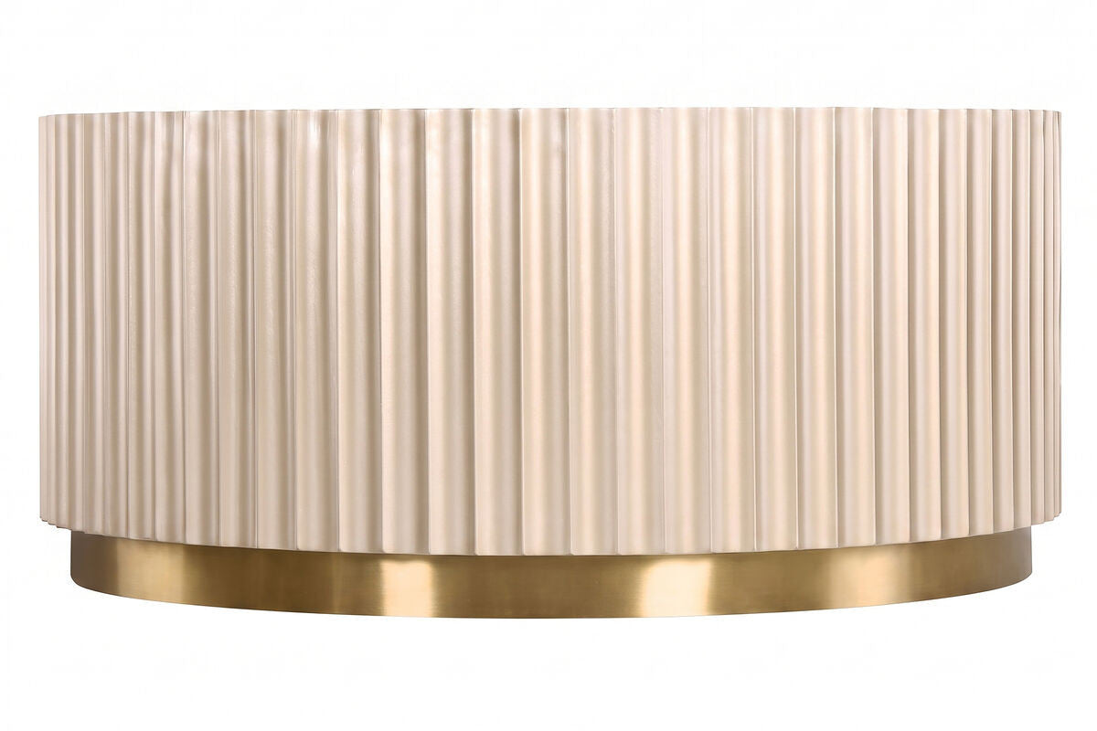 Round coffee table featuring a textured, fluted design in a soft beige color, complemented by a sleek gold stainless steel base.