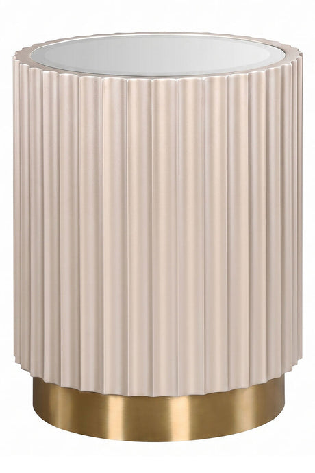 Round side table featuring a glass top and a fluted design in a soft beige color, complemented by a sleek gold base.