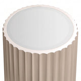 Gold side table featuring a glass top and a fluted design. The table has a scalloped edge around the top and a smooth, reflective surface.