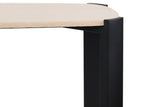 Cream marble top with subtle veining rests on a sleek black acacia wood frame, showcasing rounded corners and a modern design.