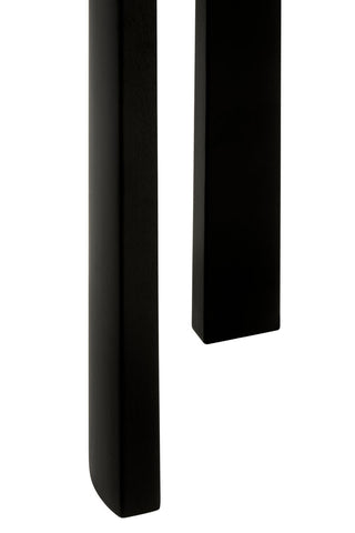 Close-up view of the black acacia wood legs of a console table, showcasing the smooth finish and clean lines.