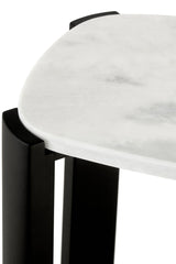 Close-up view of a console table featuring a smooth white marble top with subtle gray veining, complemented by sleek black acacia wood legs.