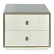 Cream-colored bedside table featuring two drawers with a ribbed design on the top drawer and a smooth finish on the bottom drawer.