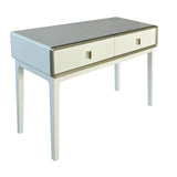 Cream-colored dressing table featuring a smooth, light wood veneer top and two textured drawers with gold-toned handles.
