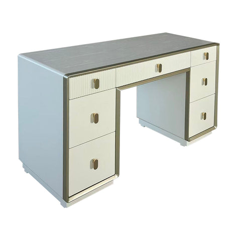 Cream-colored dressing table featuring a sleek design with seven drawers, including three larger drawers on the left and four smaller ones on the right.