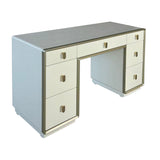 Cream-colored dressing table featuring a sleek design with seven drawers, including three larger drawers on the left and four smaller ones on the right.