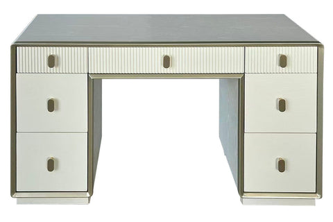 Cream-colored dressing table featuring seven drawers with a mix of smooth and ribbed fronts. The table has a sleek design with a subtle metallic trim and round handles.