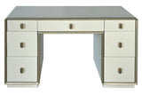 Cream-colored dressing table featuring seven drawers with a mix of smooth and ribbed fronts. The table has a sleek design with a subtle metallic trim and round handles.