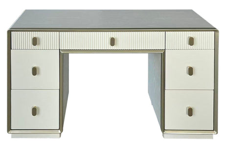 Cream-colored dressing table featuring seven drawers with a mix of smooth and ribbed fronts. The table has a sleek design with a subtle metallic trim and round handles.