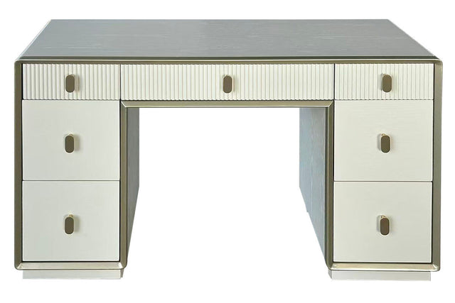 Cream-colored dressing table featuring seven drawers with a mix of smooth and ribbed fronts. The table has a sleek design with a subtle metallic trim and round handles.