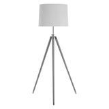 Tripod floor lamp with white drum shade and chrome legs on white background