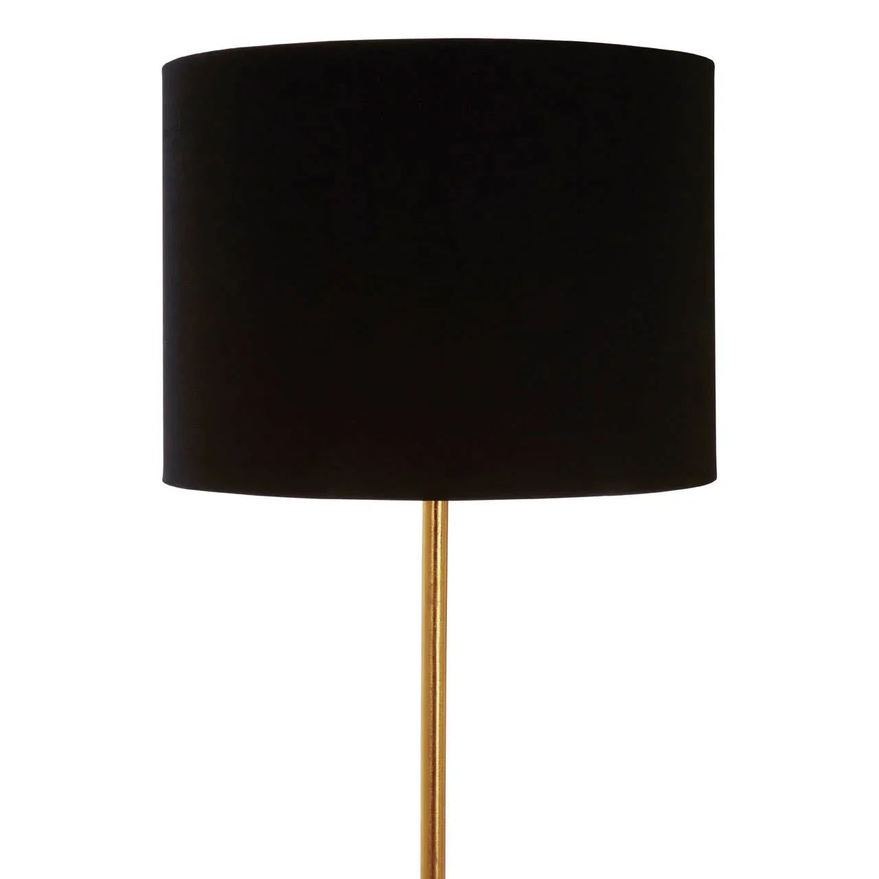 Black drum lampshade on gold metal floor lamp, close up against white background