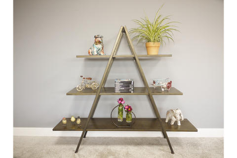 Bronze metal display shelves in an A-frame design with three horizontal tiers, shown front view in a room setting.