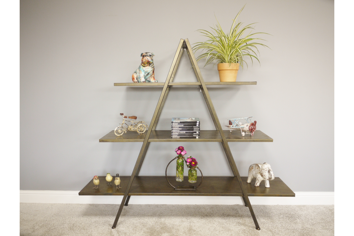 Bronze metal display shelves in an A-frame design with three horizontal tiers, shown front view in a room setting.