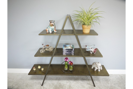 Metal A-frame display shelves with three brown shelves holding decorative items against a gray wall.