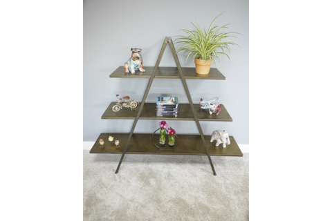 Three-tier A-frame display shelves in dark metal with decorative items, against a light grey wall and carpeted floor.