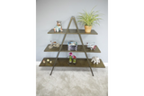 Three-tier A-frame display shelves in dark metal with decorative items, against a light grey wall and carpeted floor.