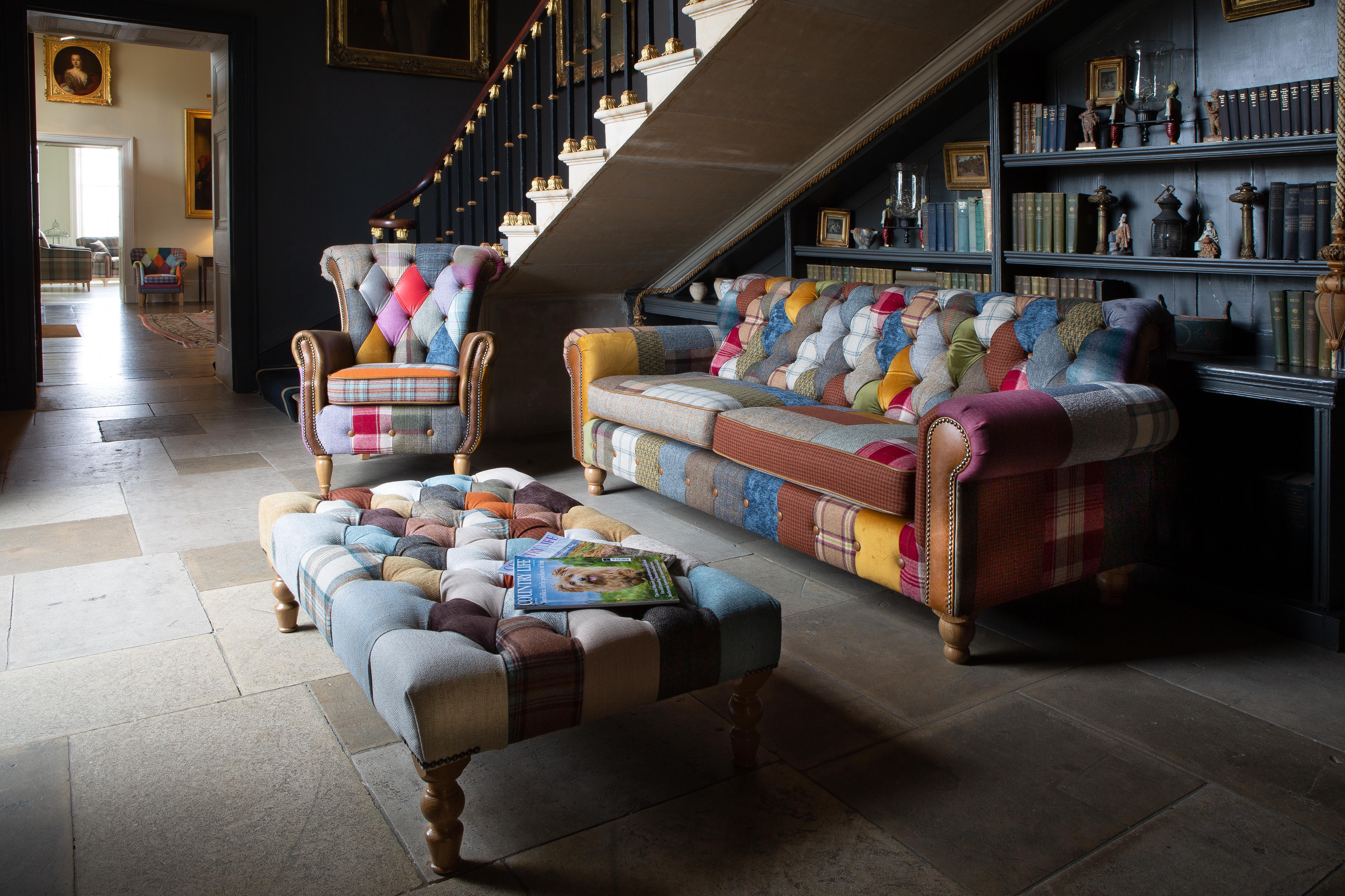 Patchwork fabric sofa set with armchair and footstool in traditional living room