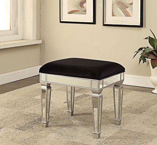 Mirrored dressing stool with black velvet seat on beige carpet in modern bedroom