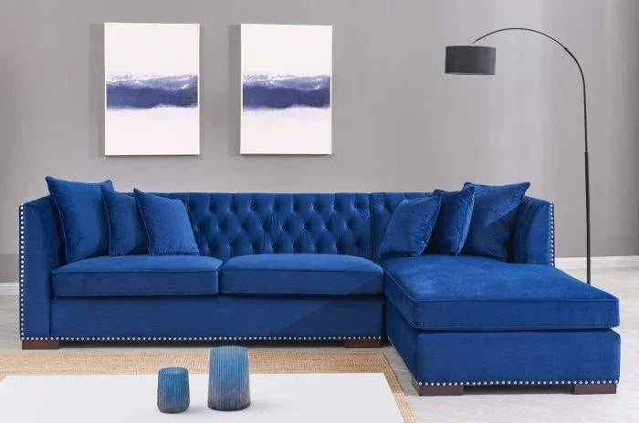 Blue velvet corner sofa with studded detail, tufted backrest and matching scatter cushions