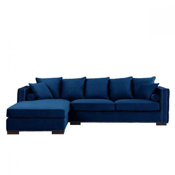 Blue velvet corner sofa with chaise and studded armrests