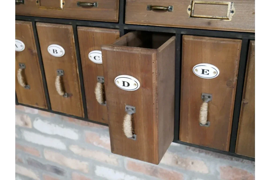 Wooden storage drawers with rope handles and labeled fronts, one drawer pulled open