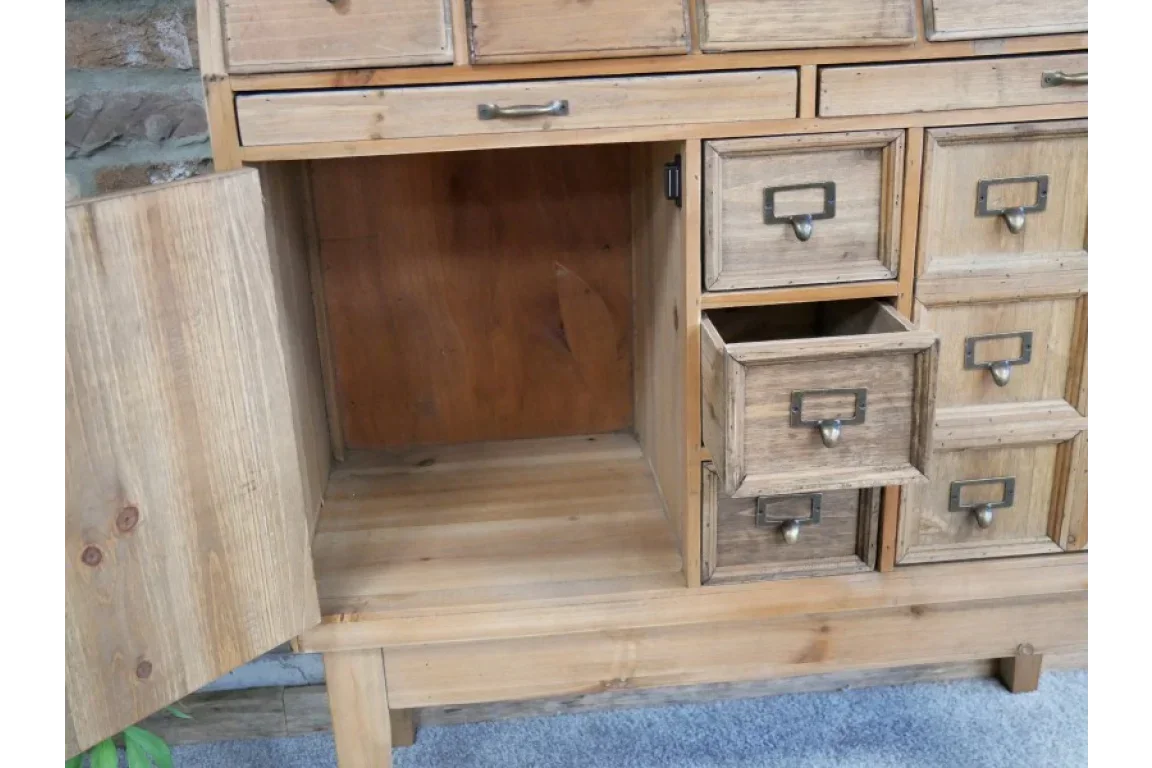 Wooden sideboard with open door and drawers, rustic storage unit on carpeted floor