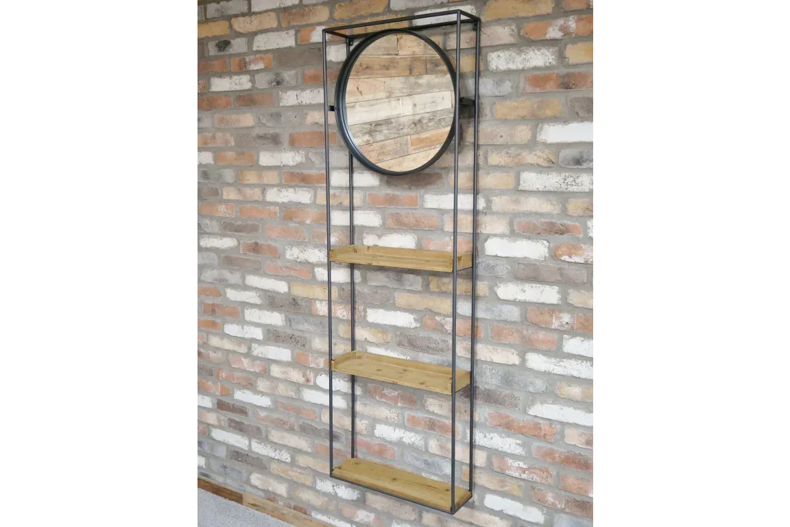 Wall mounted shelving unit with round mirror and three wooden shelves against brick wall