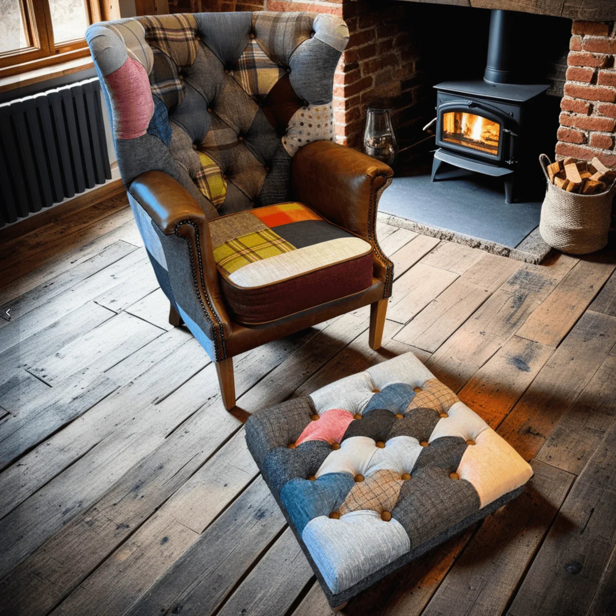 Patchwork armchair with leather arms and matching footstool in rustic living room