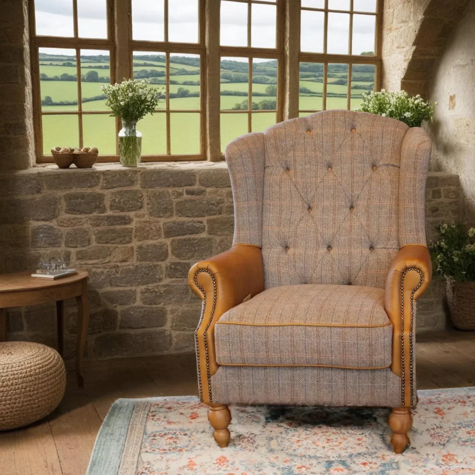 Tweed armchair with button back and tan leather arms in rustic living room