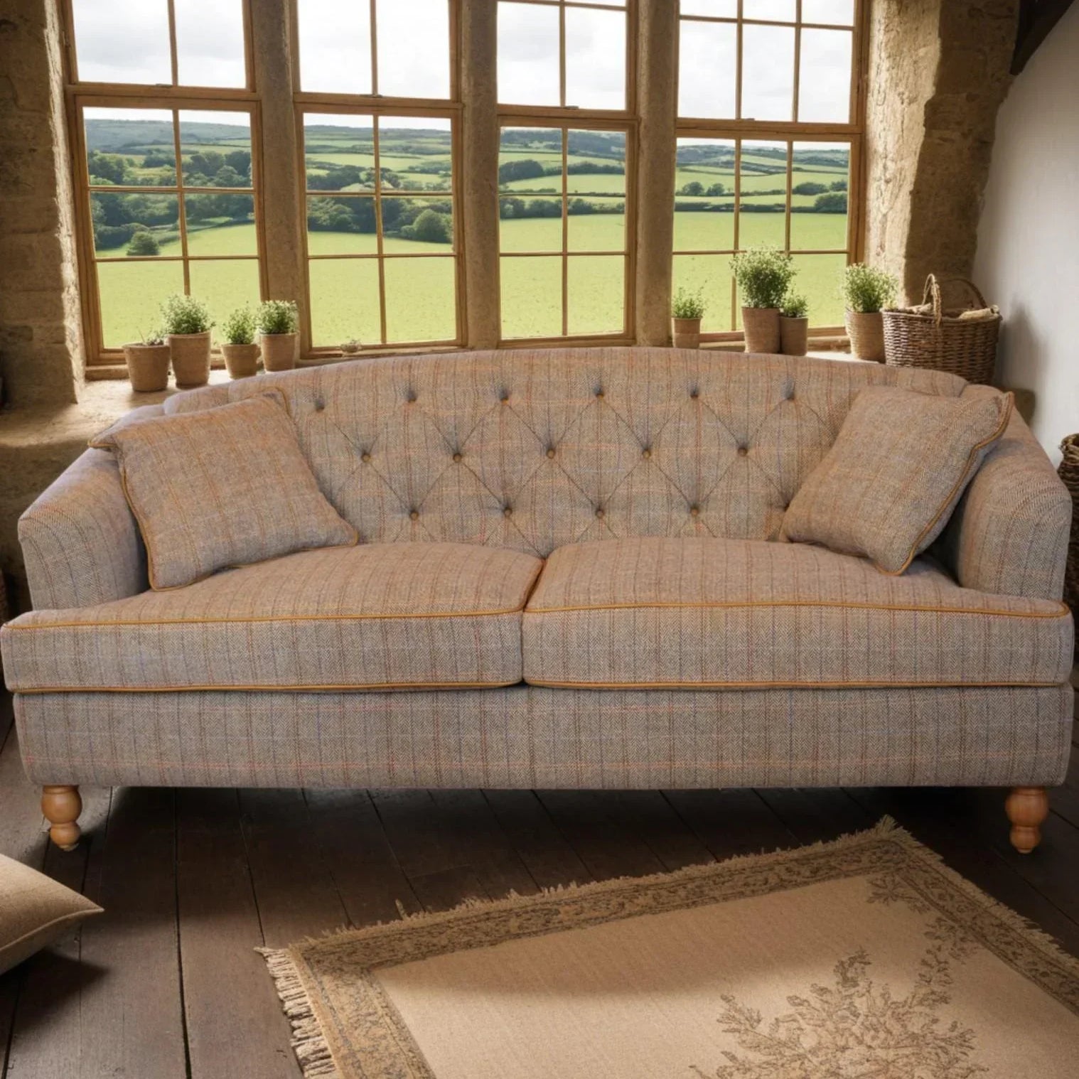 Button-tufted fabric sofa with plaid pattern and cushions in rustic living room setting